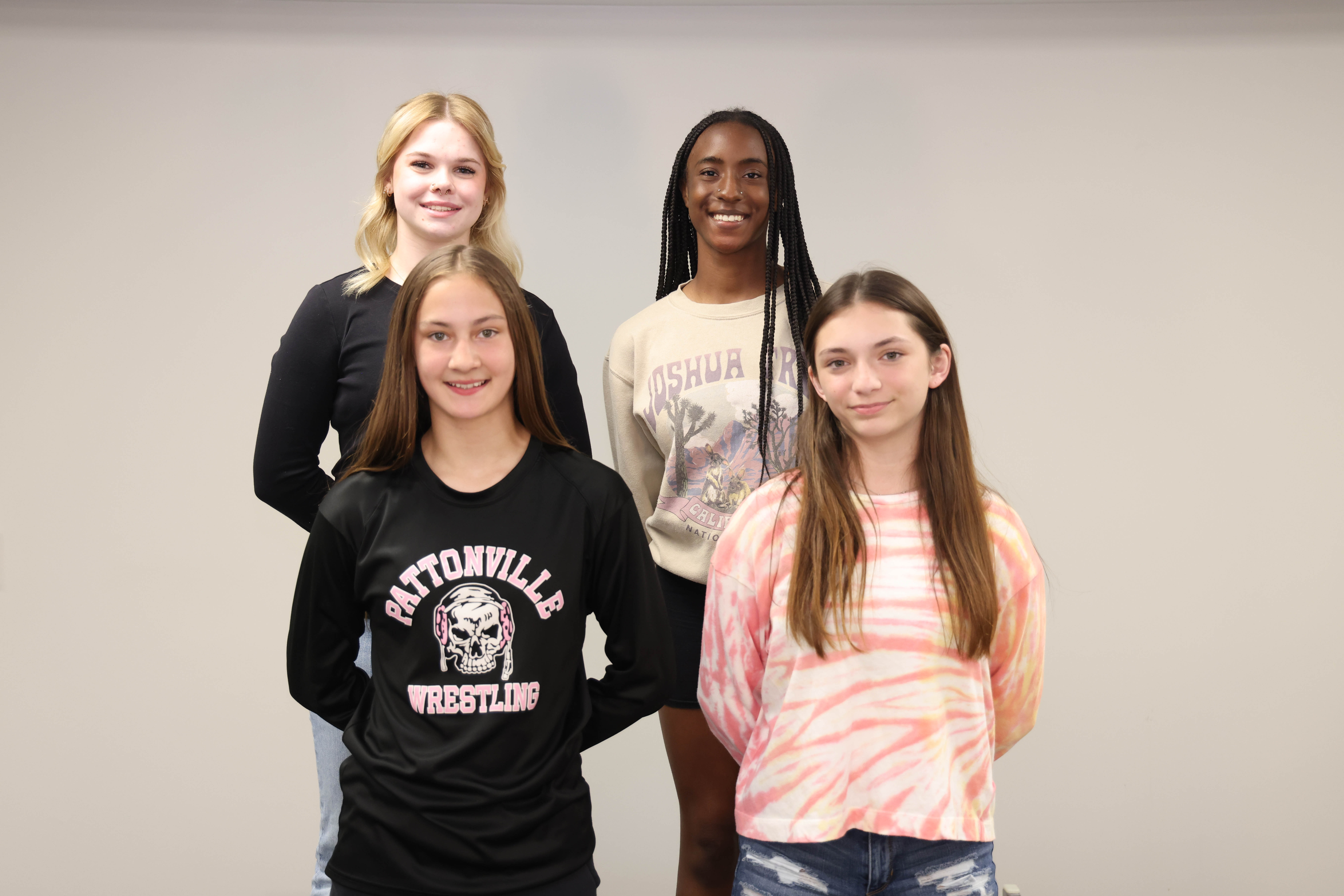 Members of the girls wrestling team pose for a photo.